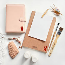Load image into Gallery viewer, Burgundy Ribbon Stickers (250 per Roll) - The Awareness Company