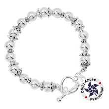 Load image into Gallery viewer, Dark Blue Pinwheel Charm Child Abuse Prevention Silver Beaded Bracelets