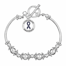 Load image into Gallery viewer, Round Child Abuse Awareness Charm Partial Beaded Bracelet - The Awareness Company