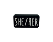 Load image into Gallery viewer, Bulk She Her Black Rectangle Silicone Pronoun Pins, LGBTQ Pronoun Pins  - The Awareness Company